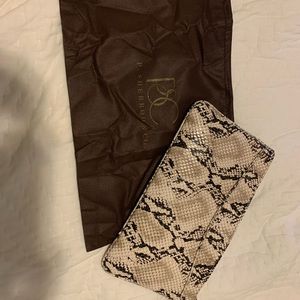 Brown snakeskin clutch with wrist strap